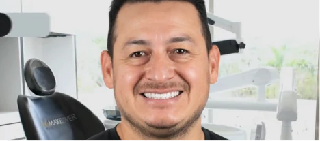 Satisfied cosmetic dentistry patient with a bright, healthy-looking veneer smile.