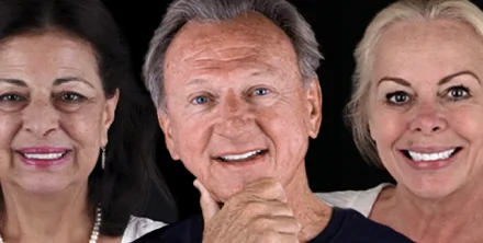 Happy dental implant patients smiling together, representing successful smile restoration treatment.