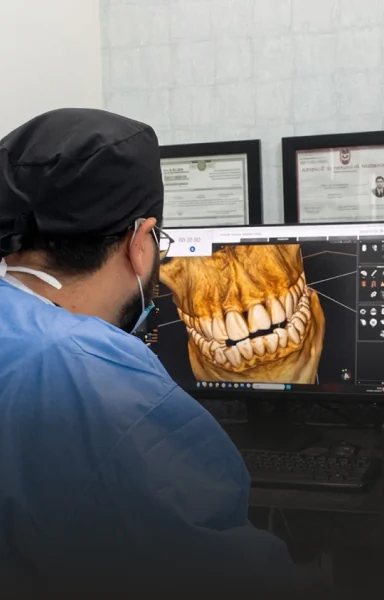 Dentist reviewing a digital 3D scan during a dental crowns consultation.