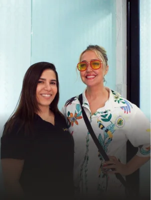 Patient celebrating outstanding dental crowns results at Smile Makeover Playa del Carmen.