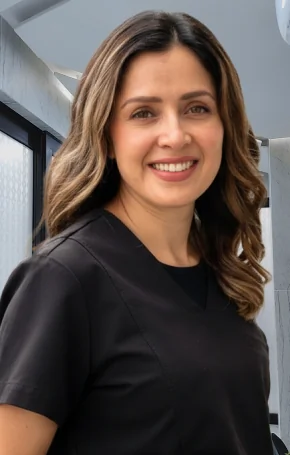 Portrait of Dr. Dulce standing in the dental operatory