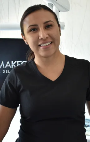 Dr. martha in dark scrubs at the Playa del Carmen dental office