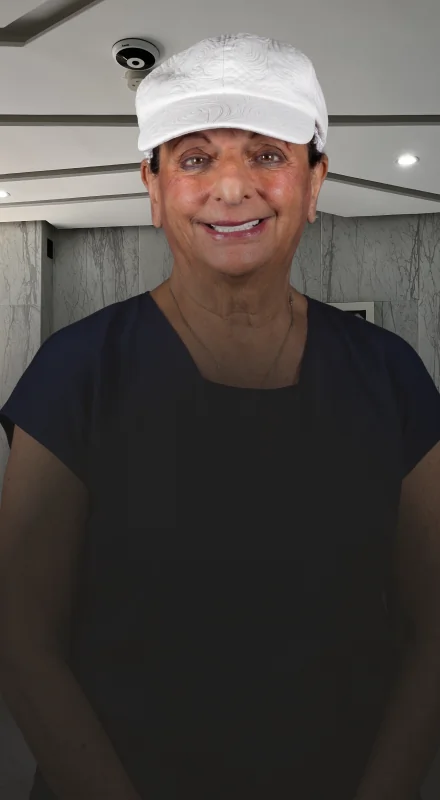 Female patient smiling confidently after succesful All-on-4 dental implant treatment in Mexico