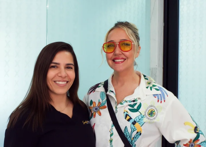 Satisfied orthodontic patient smiling after completing teeth straightening treatment