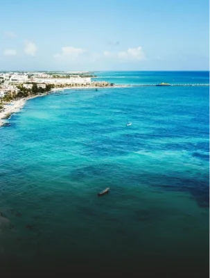 Aerial view of the turquoise Caribbean Sea along the coast of Playa del Carmen