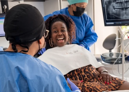 Relaxed patient receiving compassionate root canal care from the dental team at SmileMakeover Playa del Carmen Dental.