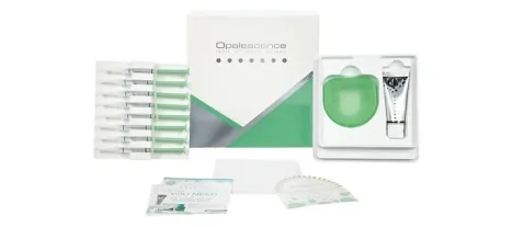 Professional take-home teeth whitening kit package including custom trays, syringes, and instructions for at-home use.